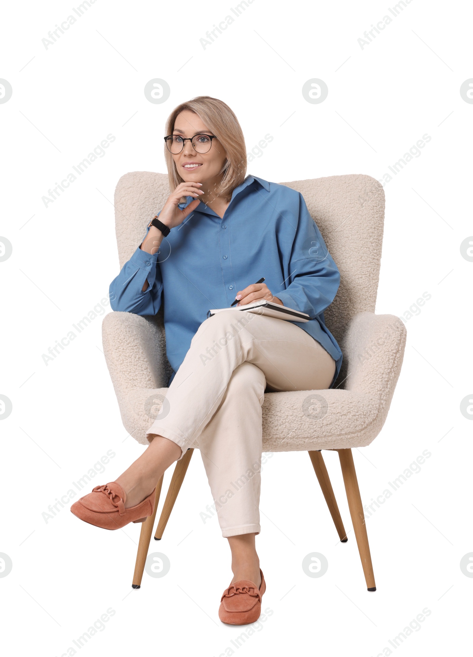 Photo of Professional psychologist with notebook sitting on chair against white background