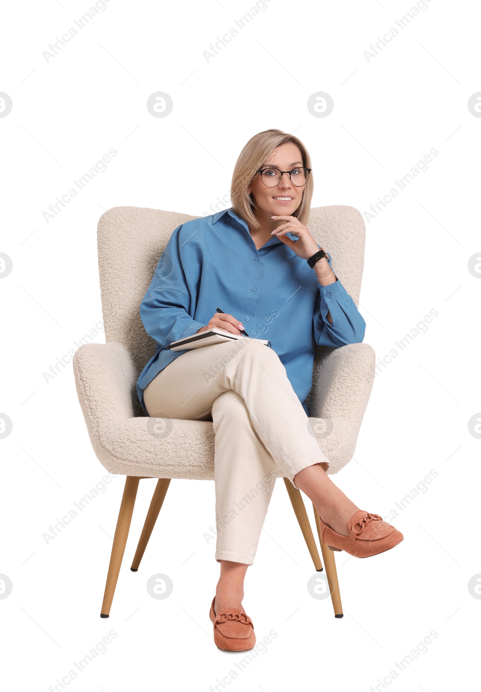 Photo of Professional psychologist with notebook sitting on chair against white background