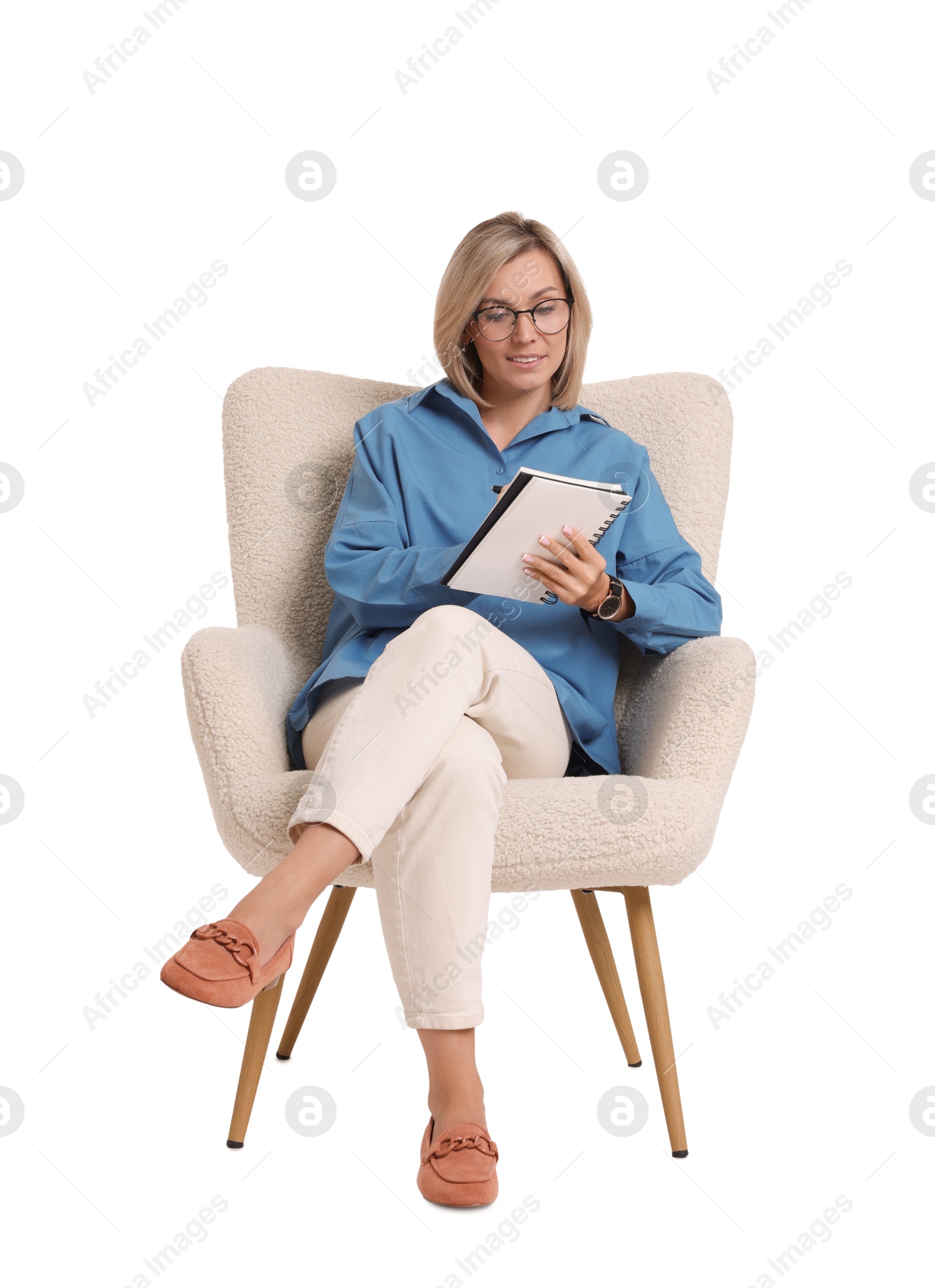 Photo of Professional psychologist with notebook sitting on chair against white background