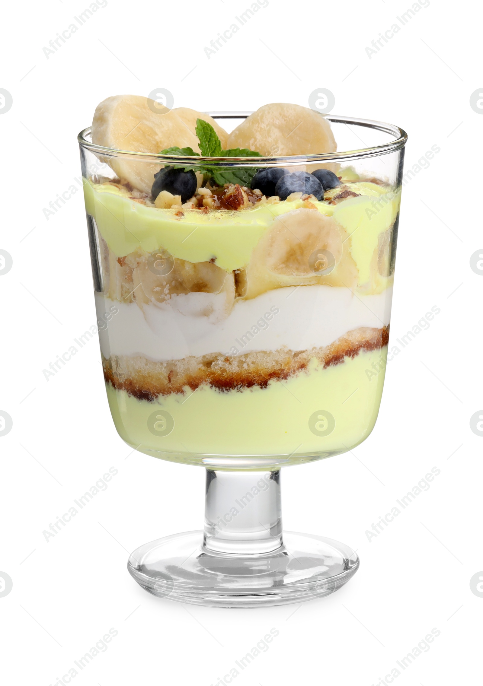 Photo of Tasty trifle dessert. Banana, blueberries, sponge cake and whipped cream in glass isolated on white