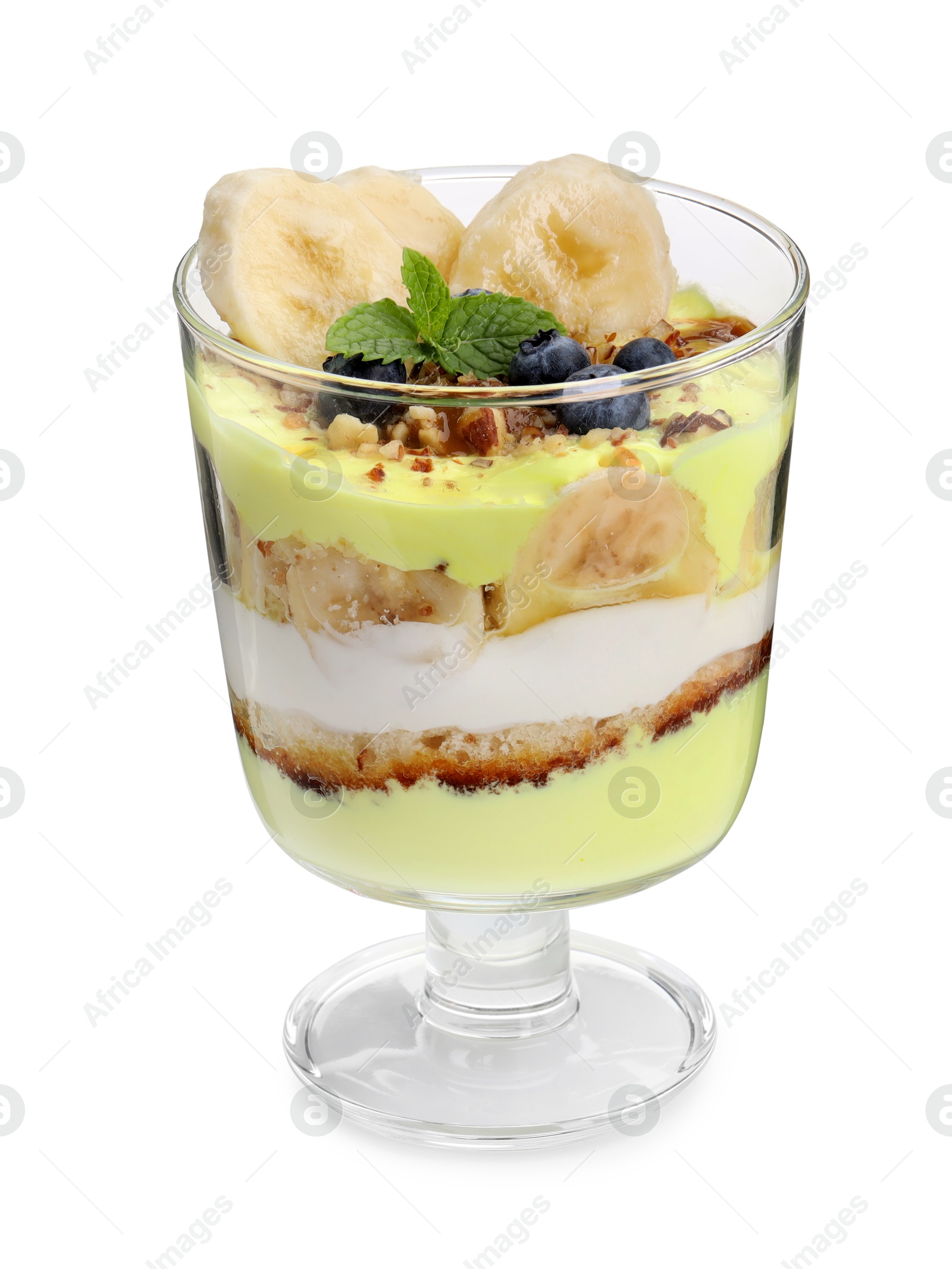 Photo of Tasty trifle dessert. Banana, blueberries, sponge cake and whipped cream in glass isolated on white