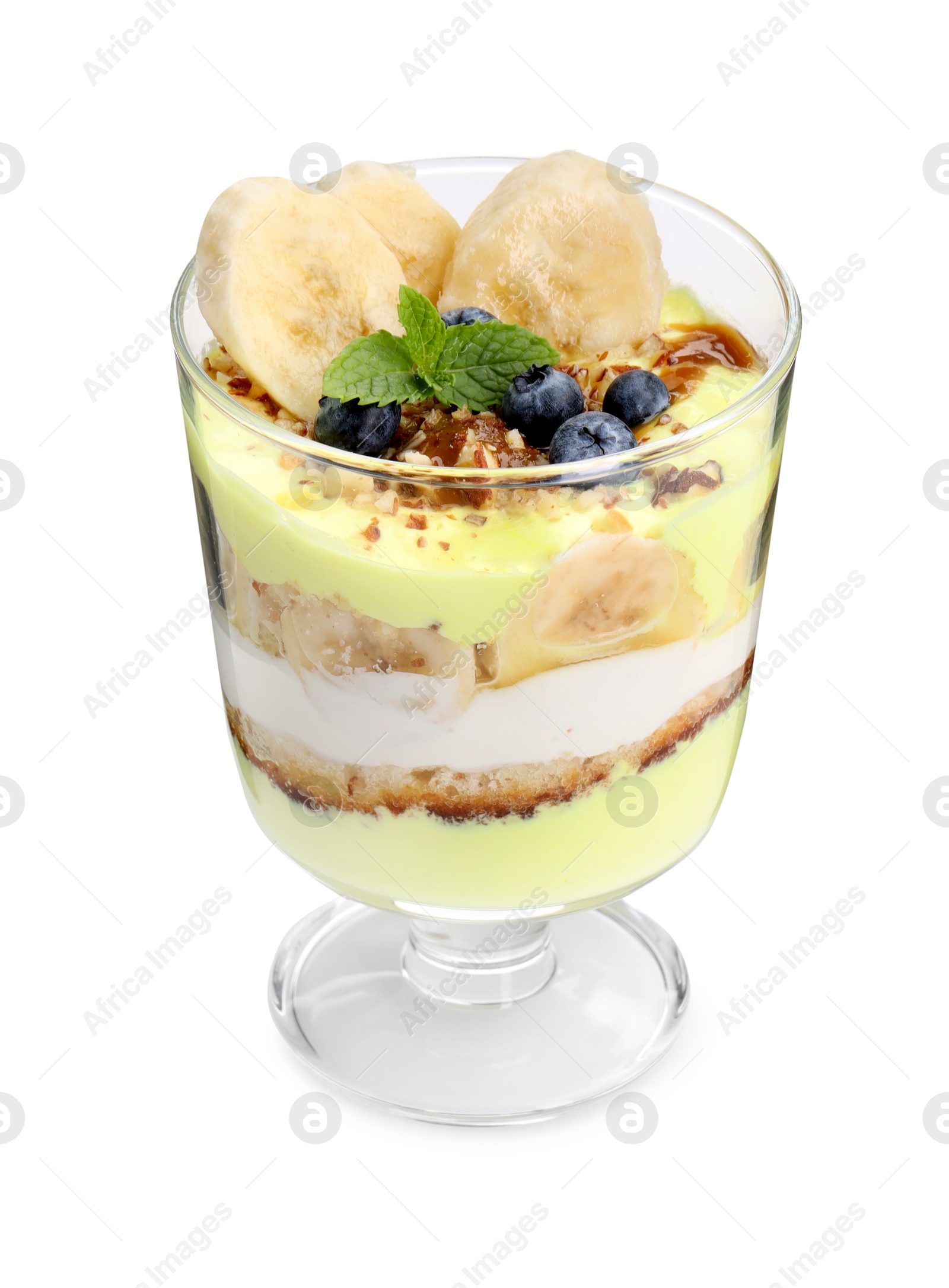 Photo of Tasty trifle dessert. Banana, blueberries, sponge cake and whipped cream in glass isolated on white