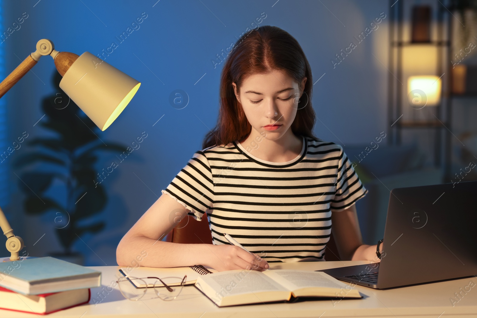 Photo of Student preparing for exam at table indoors