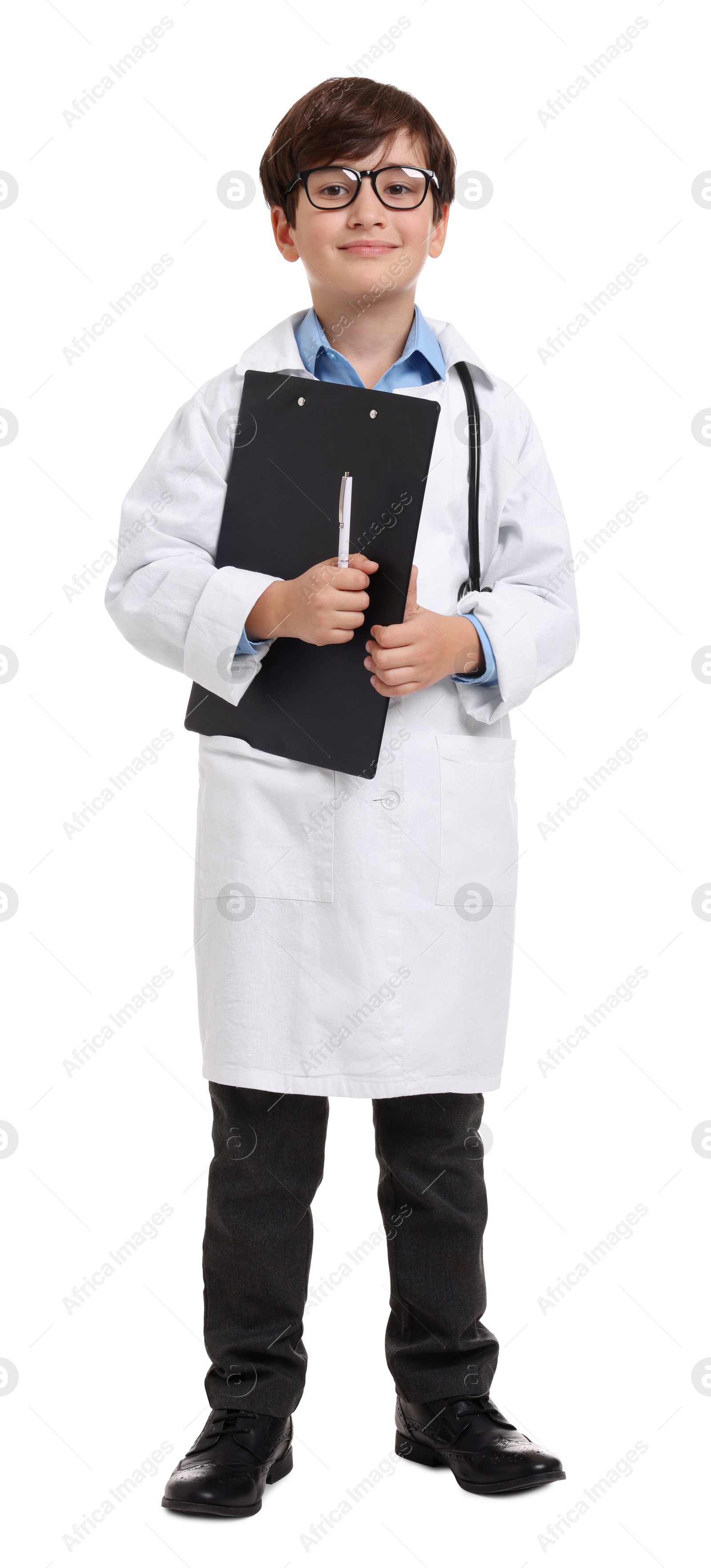 Photo of Boy with stethoscope and clipboard pretending to be doctor on white background. Dreaming of future profession