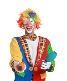 Photo of Happy clown juggling clubs on white background