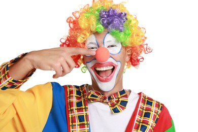 Photo of Portrait of happy clown pointing at his nose on white background