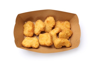 Photo of Delicious chicken nuggets in carton box isolated on white, top view