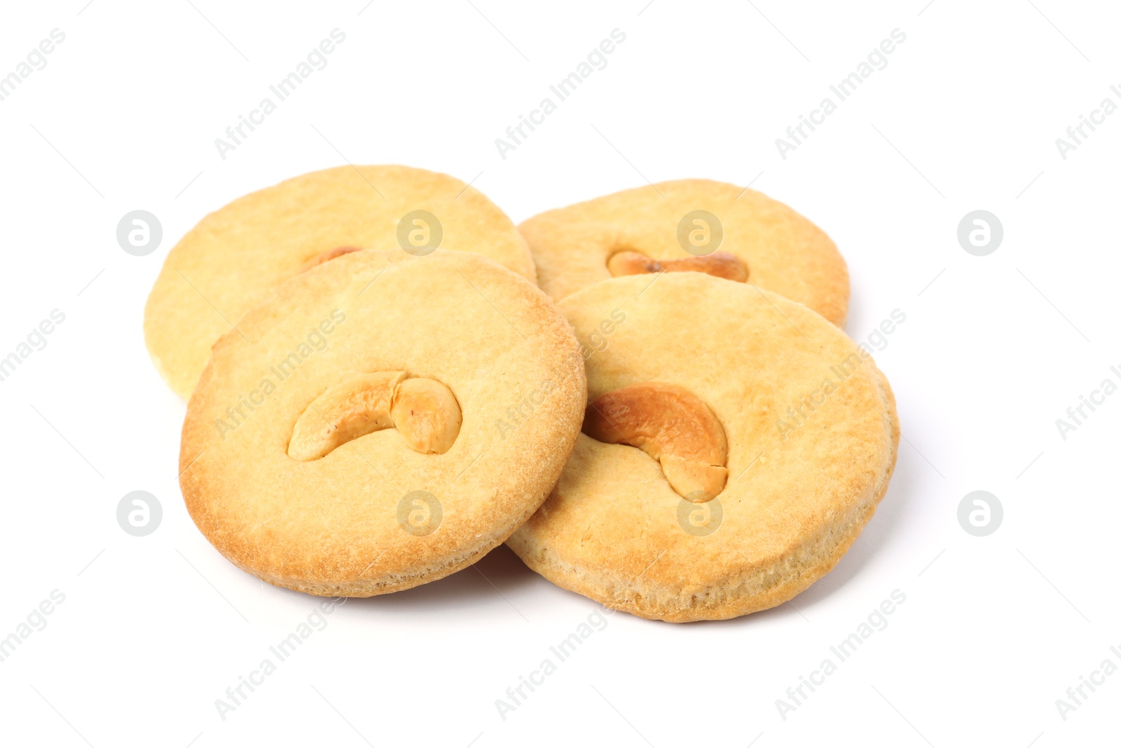 Photo of Many tasty cashew cookies isolated on white