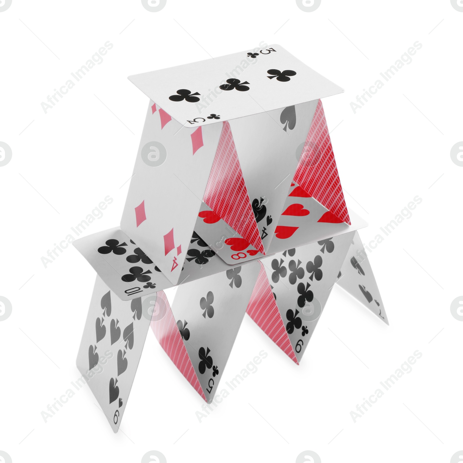 Photo of House of playing cards isolated on white