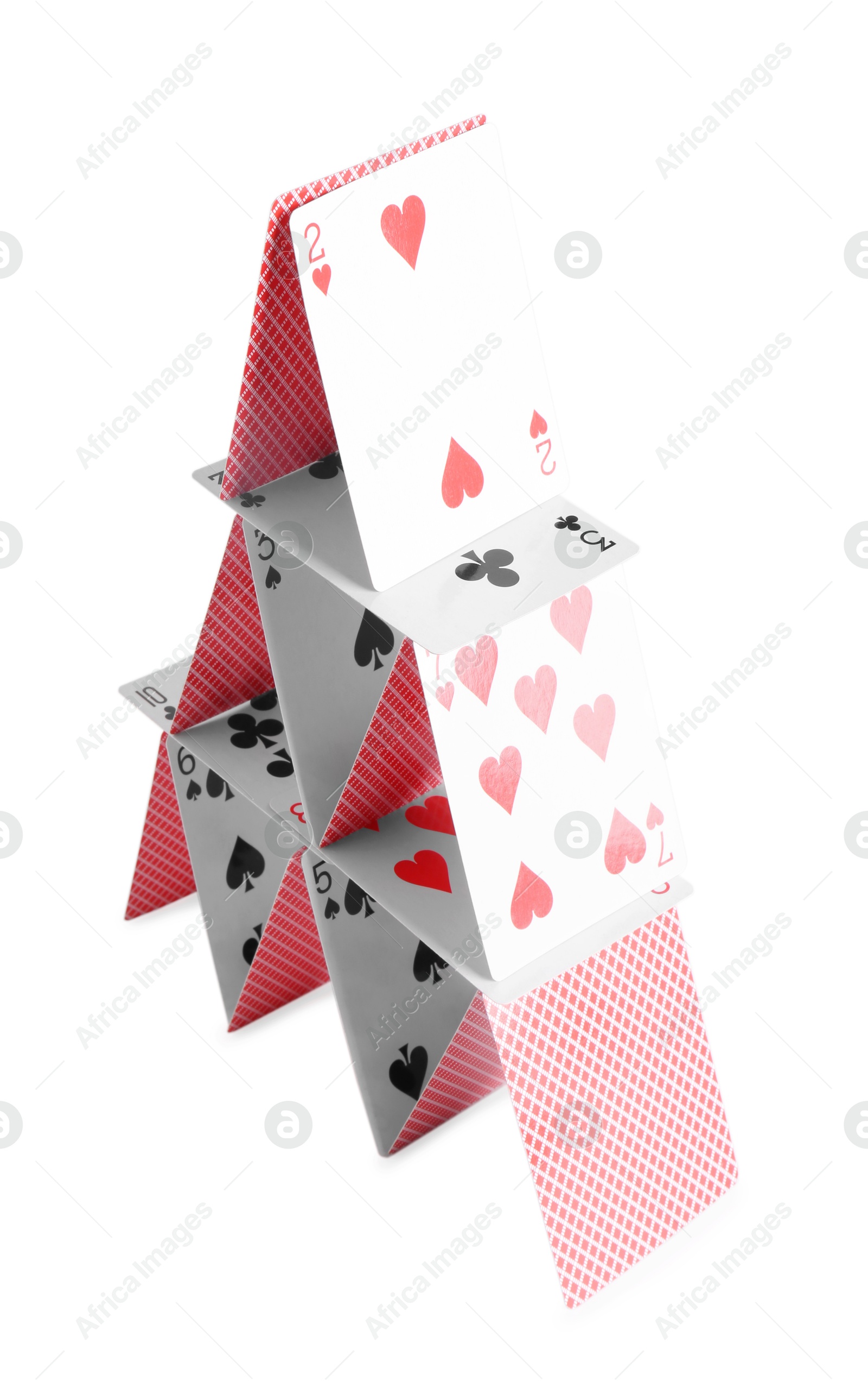 Photo of House of playing cards isolated on white