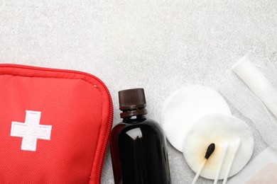 Photo of Topical iodine and other first aid kit components on light background, flat lay. Space for text