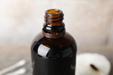 Photo of Bottle of topical iodine on blurred background, closeup