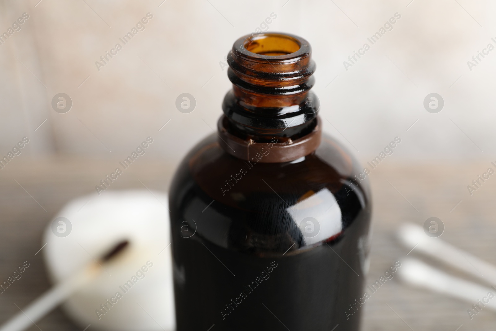 Photo of Bottle of topical iodine on blurred background, closeup