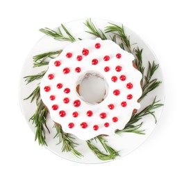 Photo of Tasty Christmas cake with red currants and rosemary isolated on white, top view