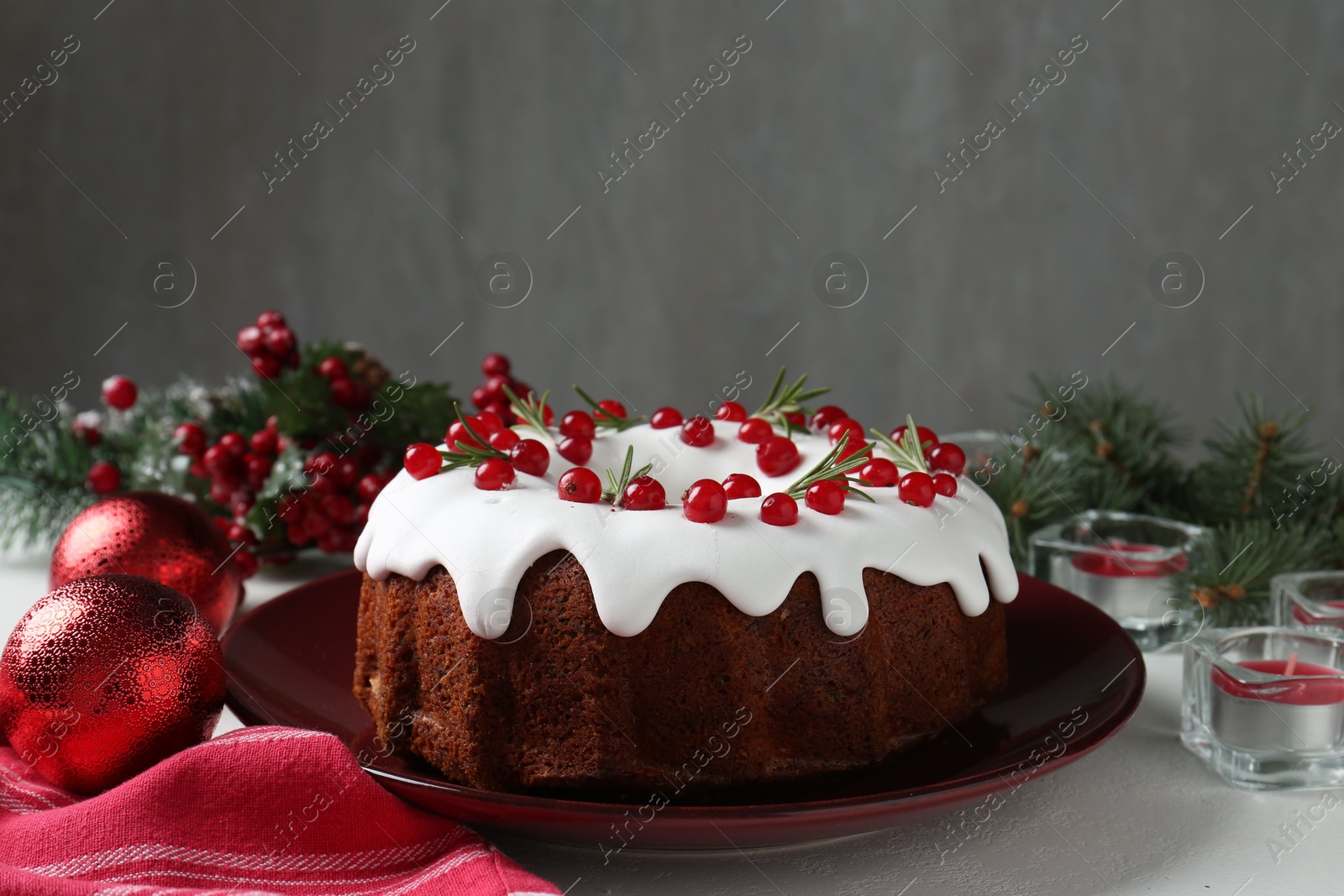 Photo of Traditional classic Christmas cake and decor on white table