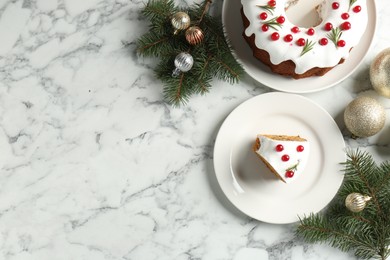 Photo of Traditional classic Christmas cake and decor on white marble table, flat lay. Space for text