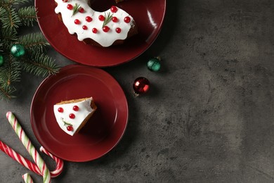 Photo of Traditional classic Christmas cake and decor on gray textured table, flat lay. Space for text