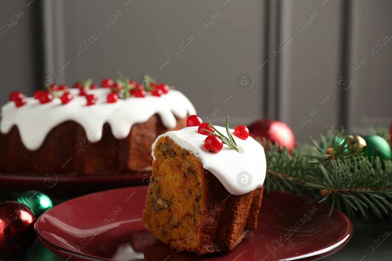 Photo of Traditional classic Christmas cake and decor on gray textured table