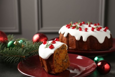 Photo of Traditional classic Christmas cake and decor on gray textured table