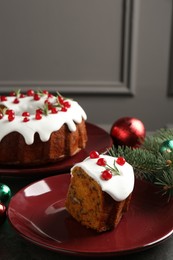 Photo of Traditional classic Christmas cake and decor on gray textured table