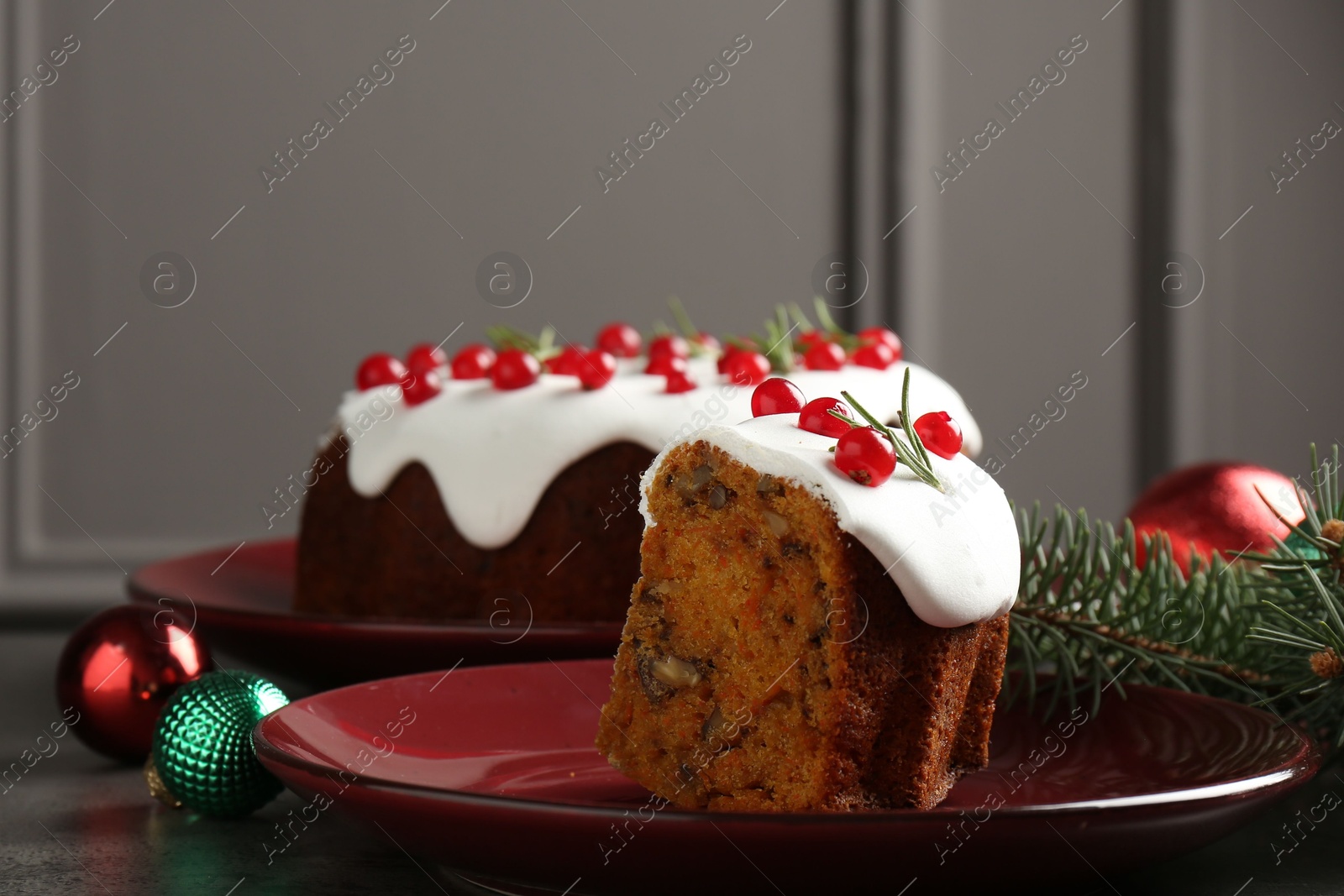 Photo of Traditional classic Christmas cake and decor on gray textured table