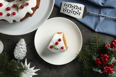 Photo of Traditional classic Christmas cake, decor and cake server on gray textured table, flat lay