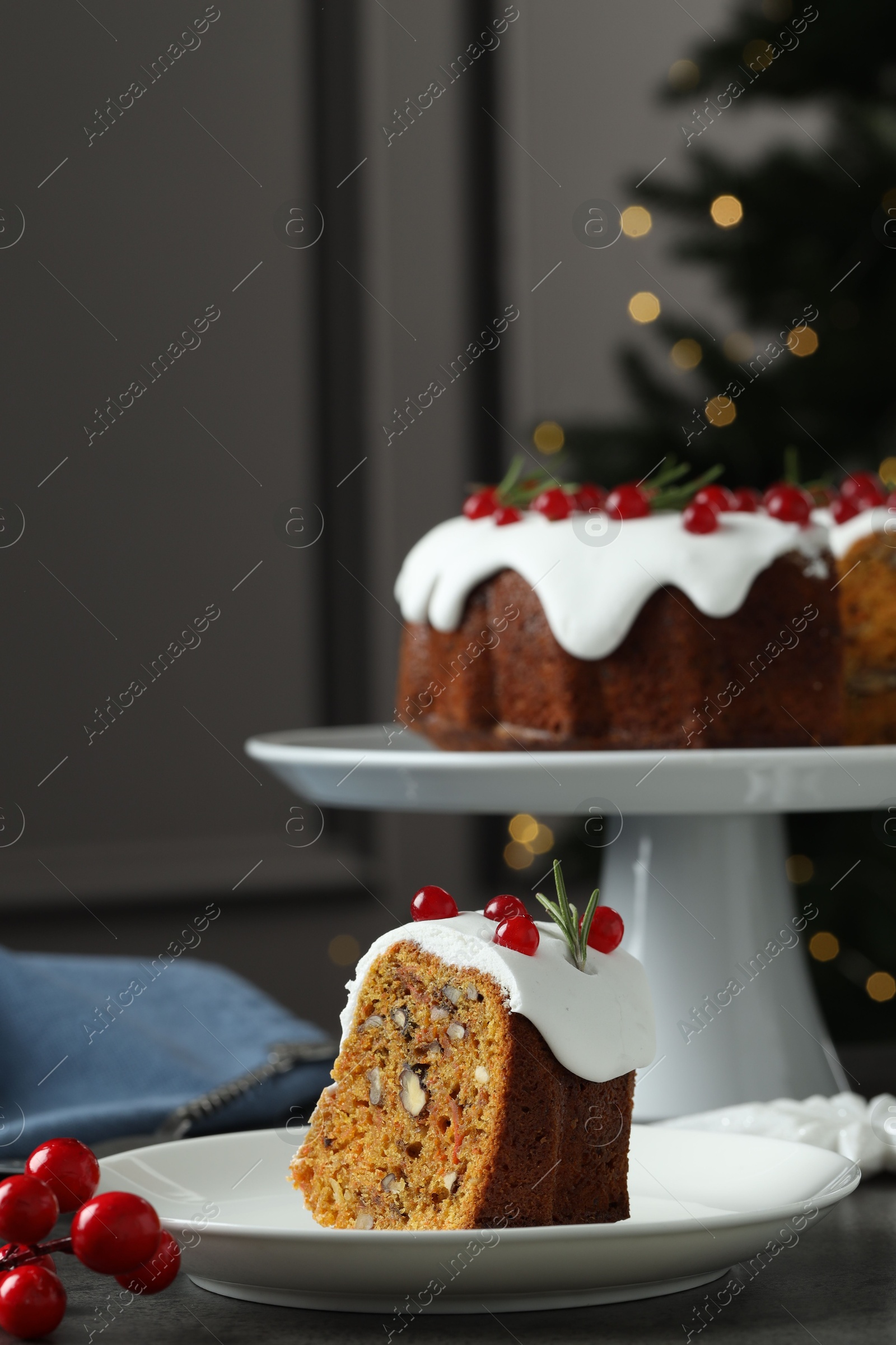 Photo of Traditional Christmas cake decorated with red currants and rosemary