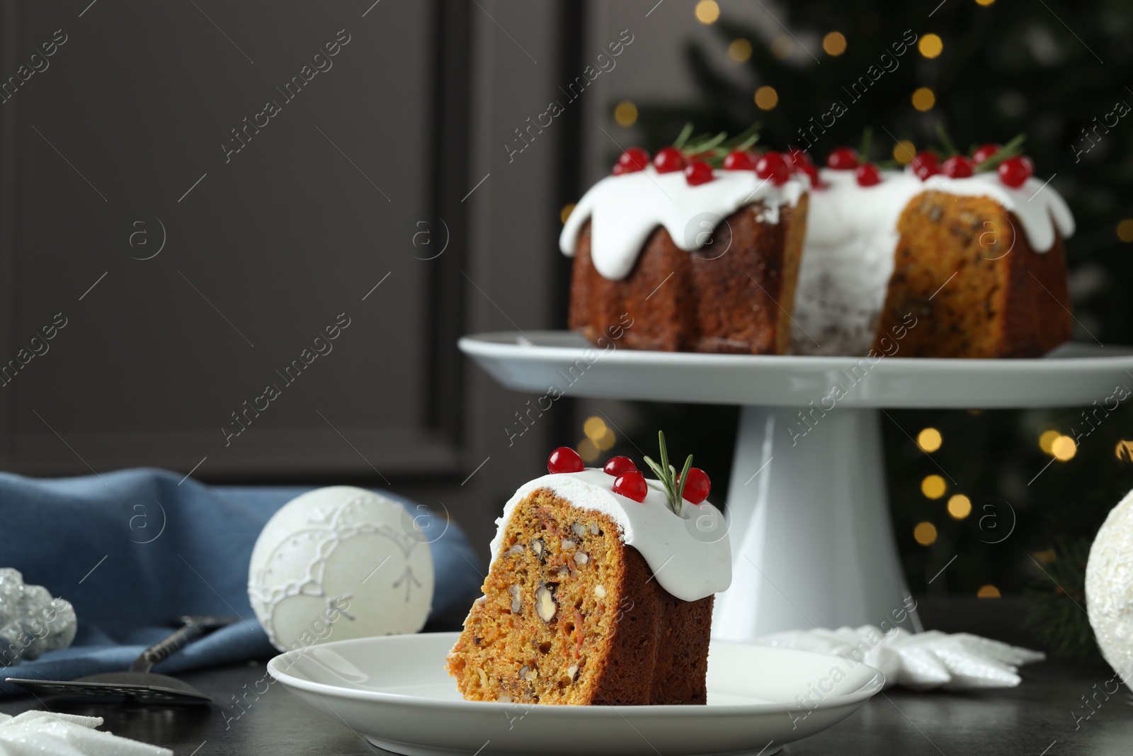 Photo of Traditional classic Christmas cake, decor and cake server on gray textured table