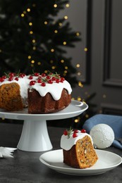 Photo of Traditional classic Christmas cake and decor on gray textured table