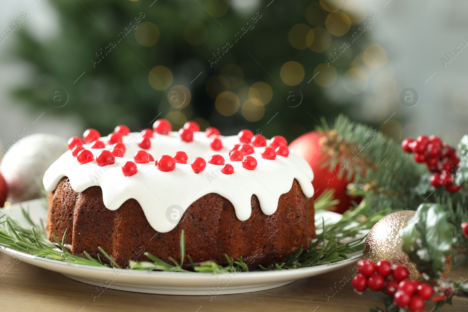 Photo of Traditional classic Christmas cake and decor on wooden table