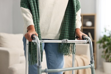 Photo of Senior woman with walking frame at home, closeup