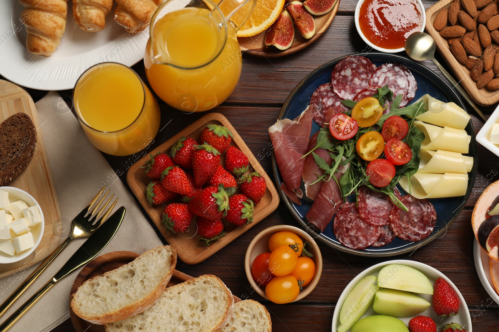 Photo of Different tasty food served for brunch on wooden table, flat lay