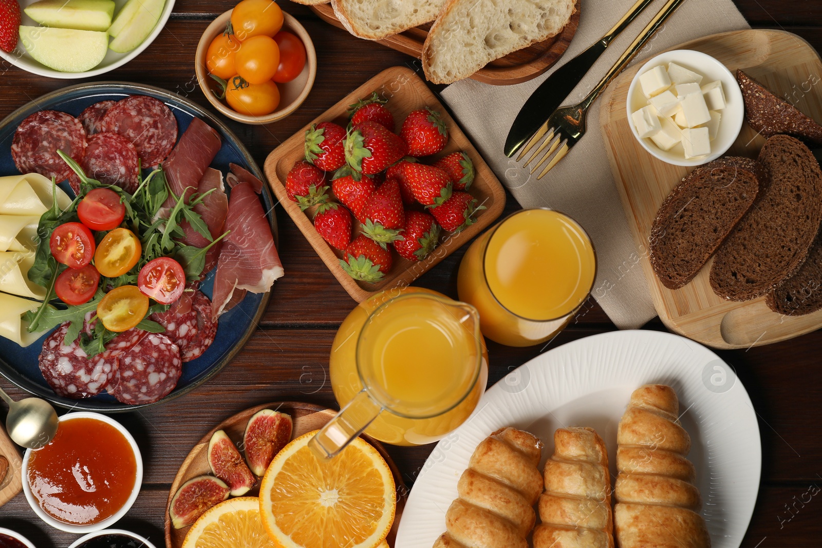 Photo of Different tasty food served for brunch on wooden table, flat lay