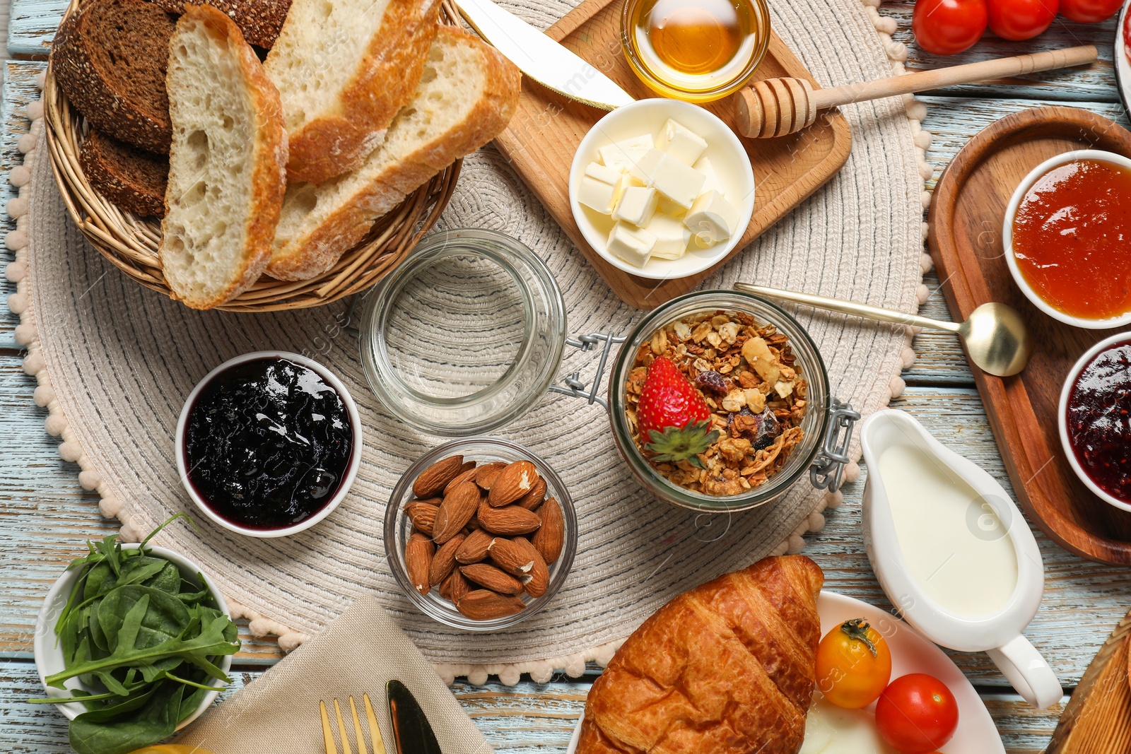 Photo of Different tasty food served for brunch on white wooden table, flat lay