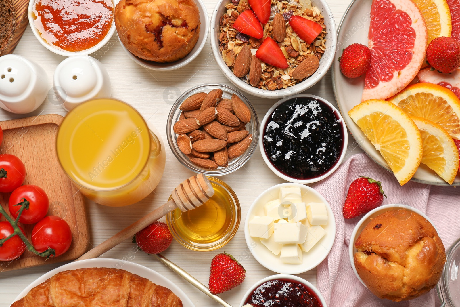 Photo of Different tasty food served for brunch on white wooden table, flat lay