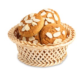 Photo of Tasty cookies with almond flakes in wicker basket isolated on white