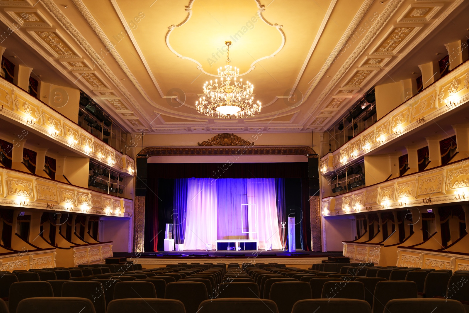 Photo of Theatre interior with stage and rows of comfortable seats