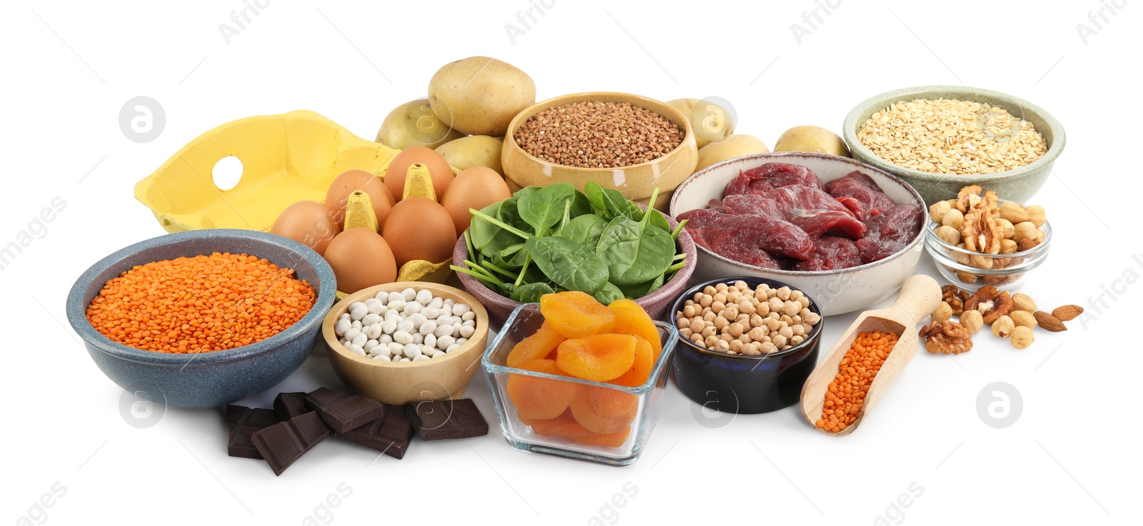 Photo of Different products rich in iron on white background. Anemia diet plan