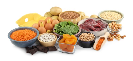 Photo of Different products rich in iron on white background. Anemia diet plan