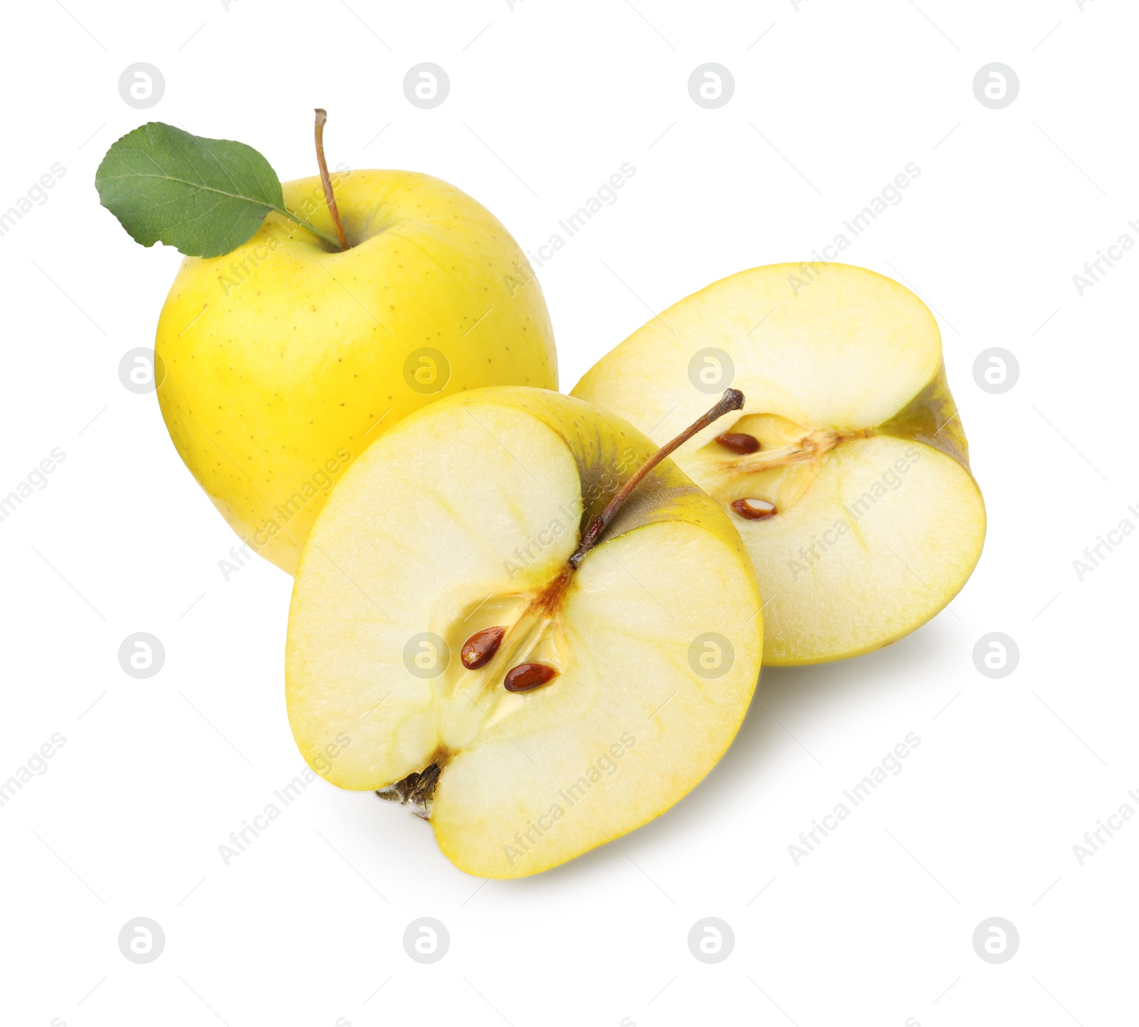 Photo of Whole and cut ripe yellow apples isolated on white