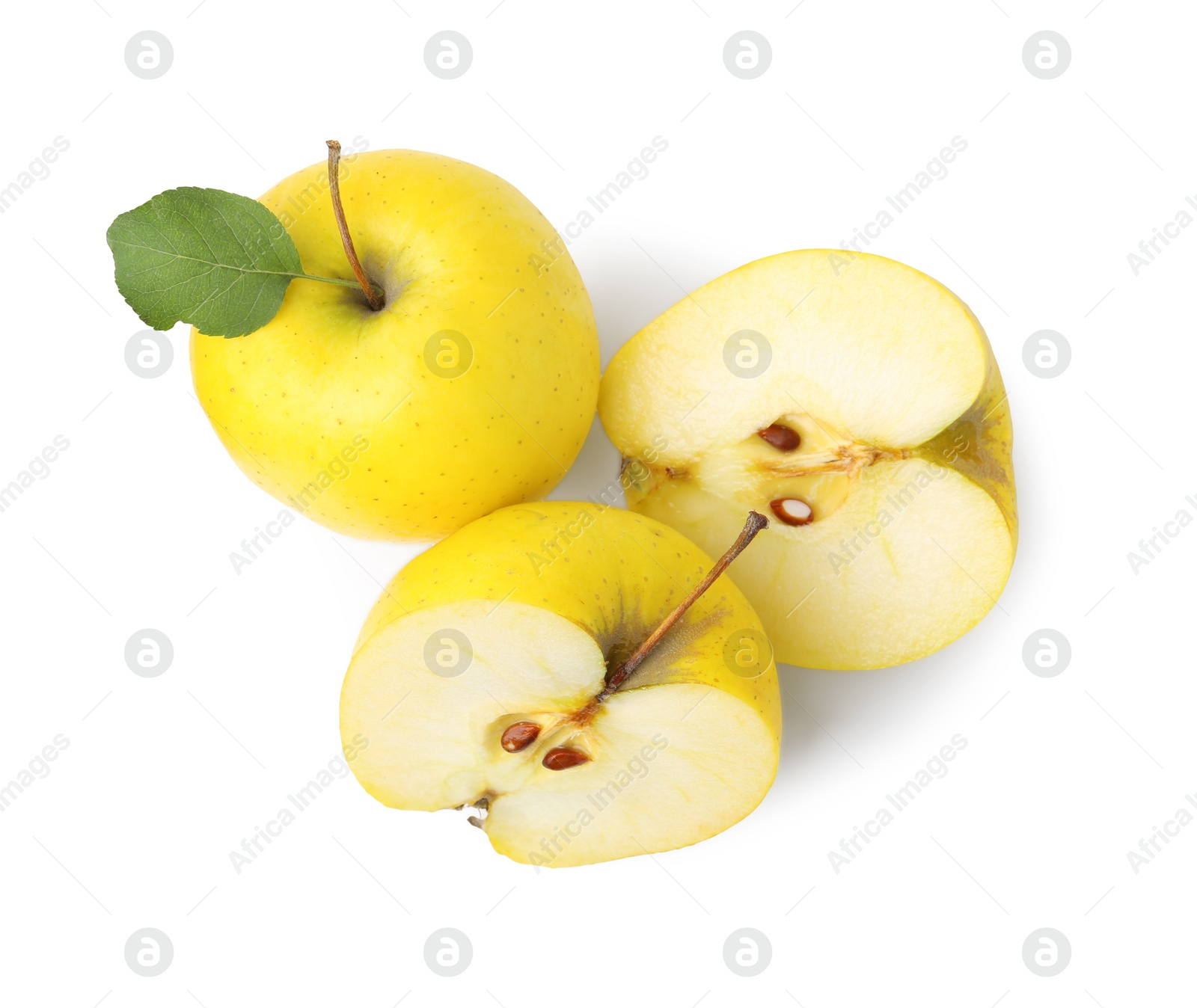 Photo of Whole and cut ripe yellow apples isolated on white, top view