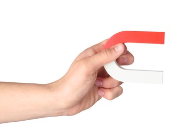 Photo of Man with horseshoe magnet on white background, closeup