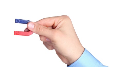 Photo of Man with horseshoe magnet on white background, closeup