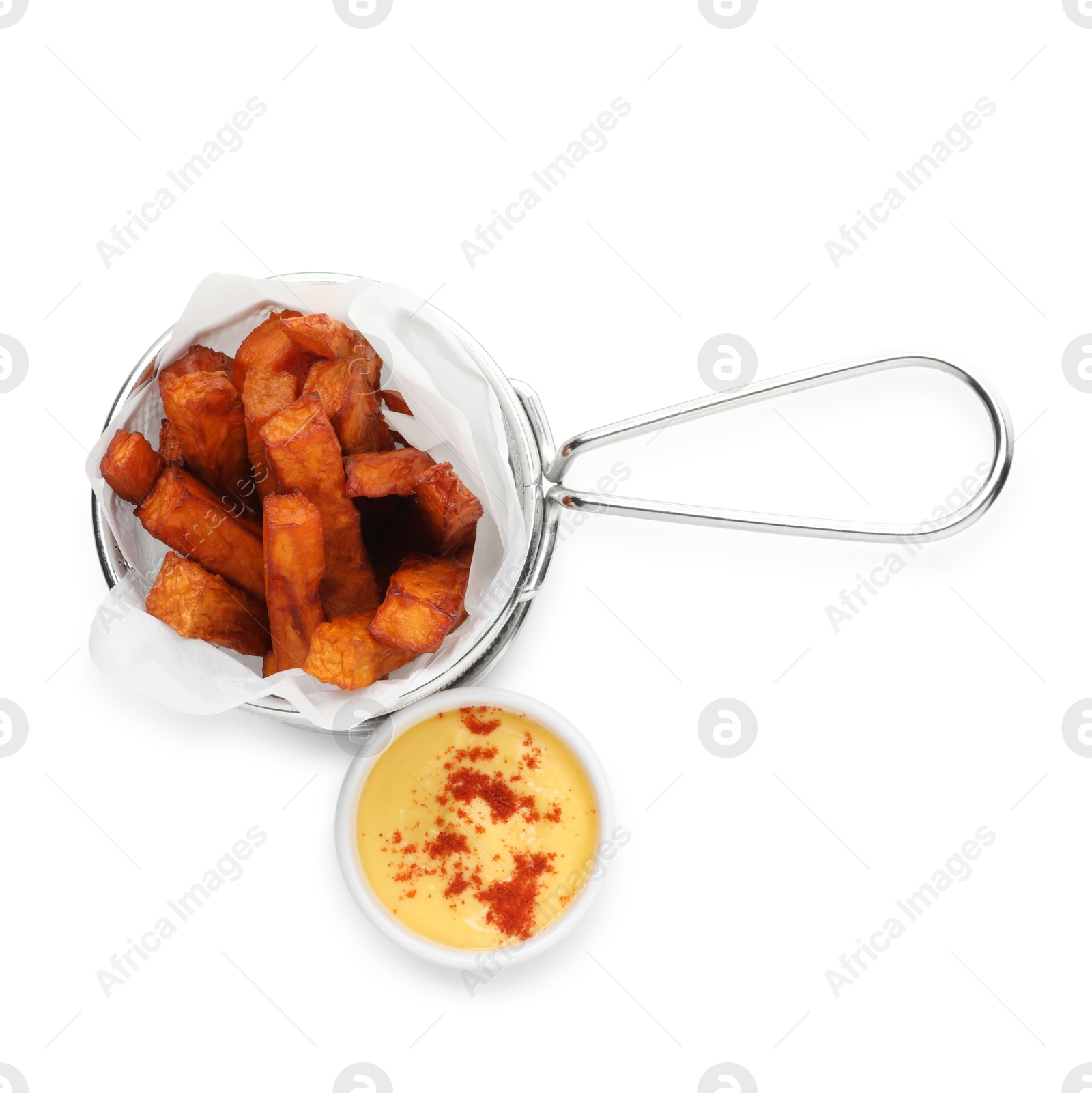 Photo of Sweet potato fries in metal basket and sauce isolated on white, top view