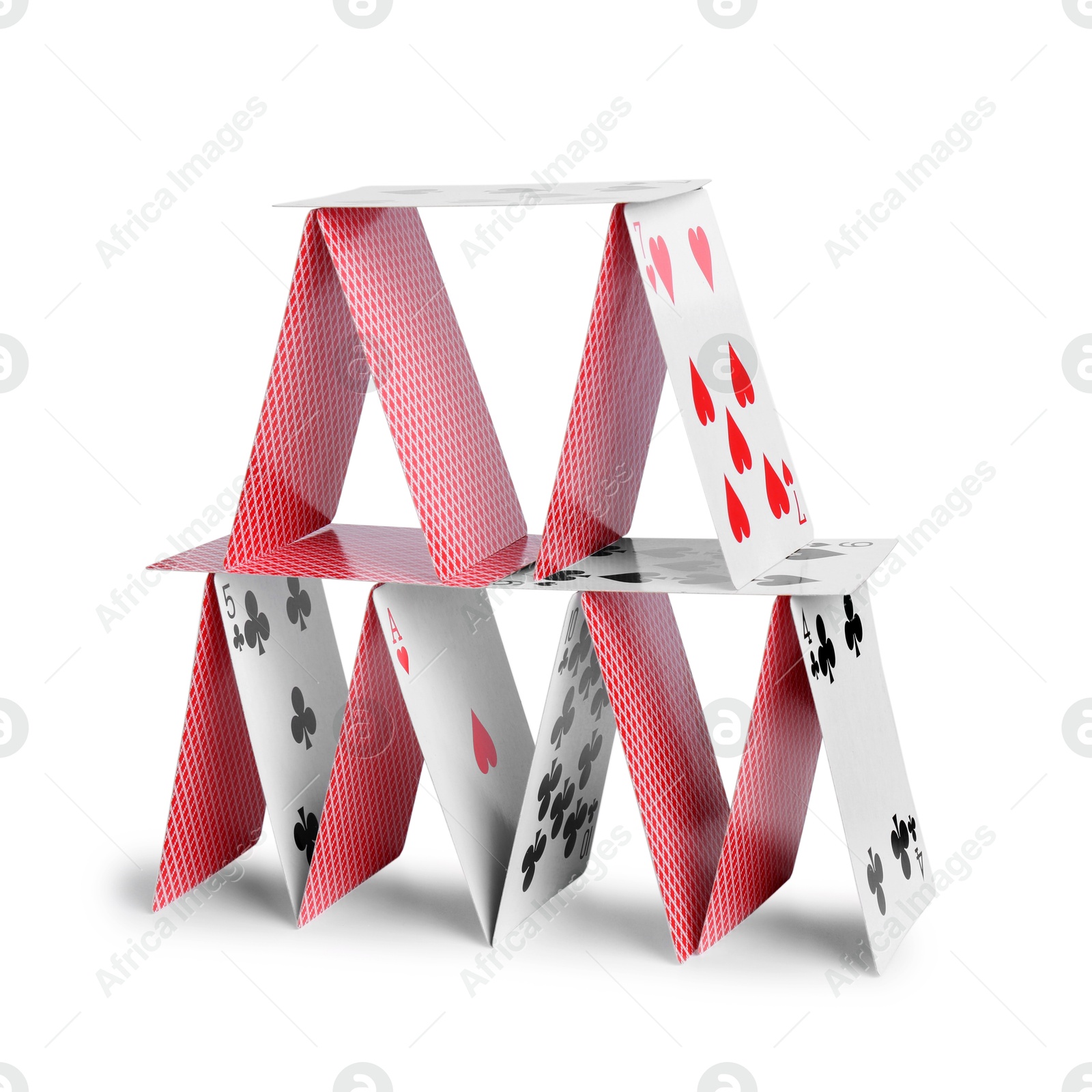 Photo of House of playing cards isolated on white