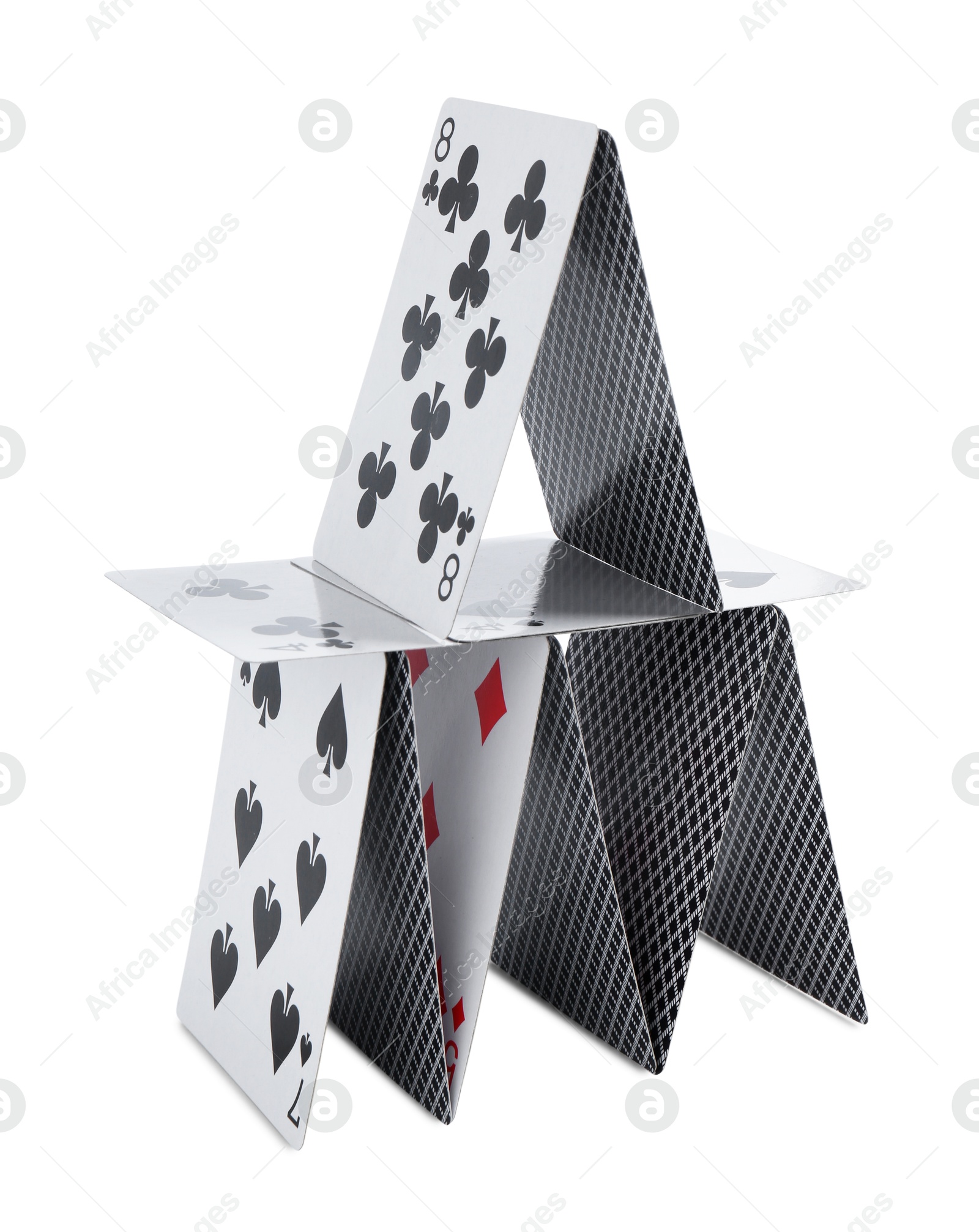 Photo of House of playing cards isolated on white