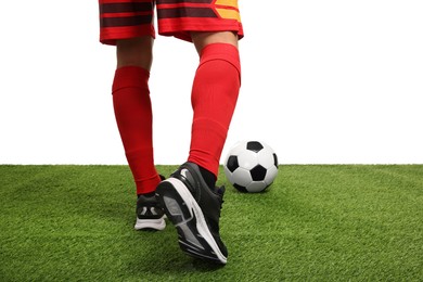 Photo of Football player with soccer ball on artificial grass against white background, closeup