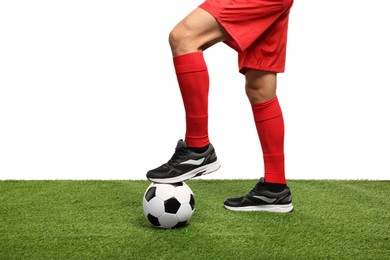 Photo of Football player with soccer ball on artificial grass against white background, closeup