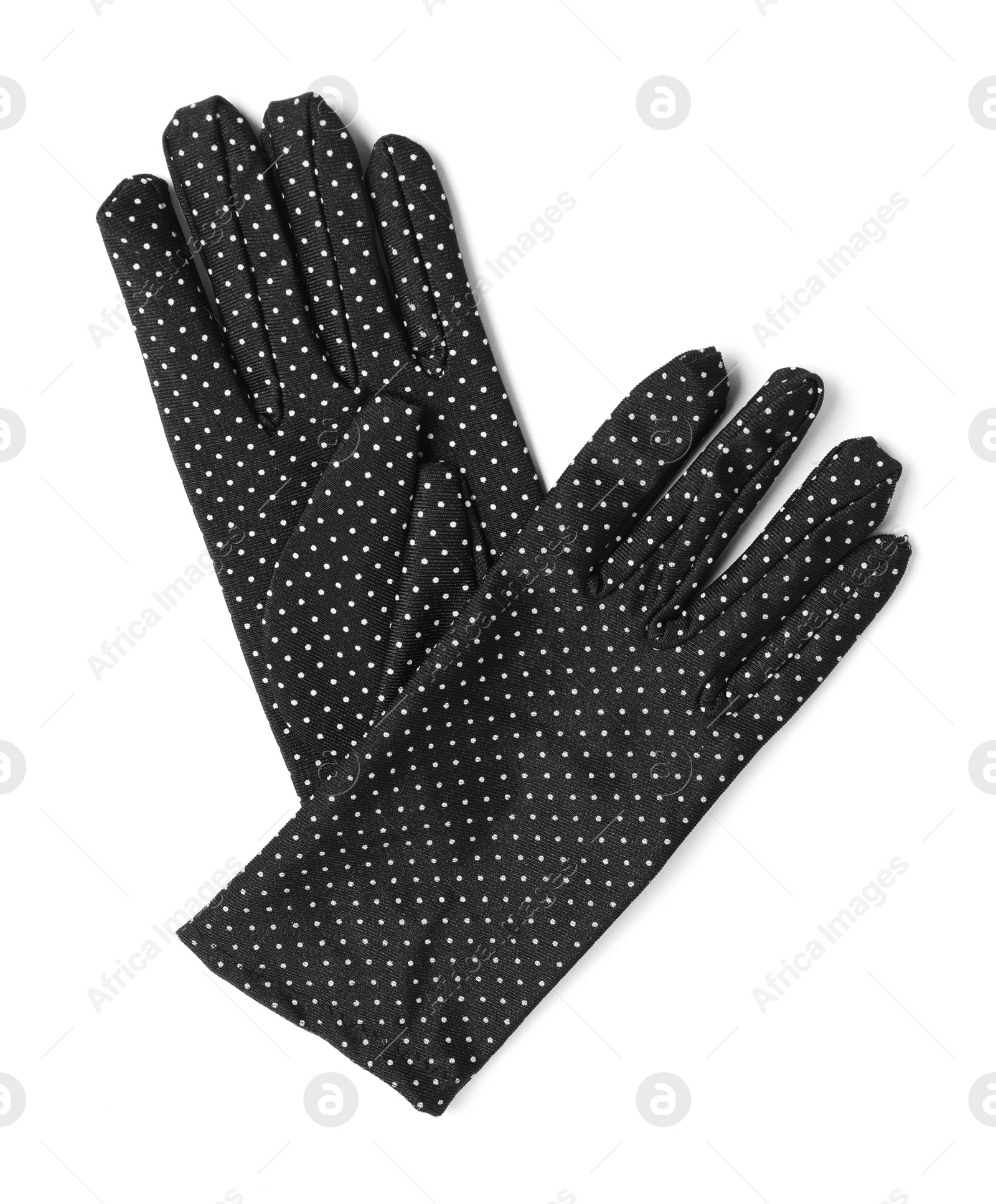 Photo of Elegant polka dot gloves isolated on white, top view