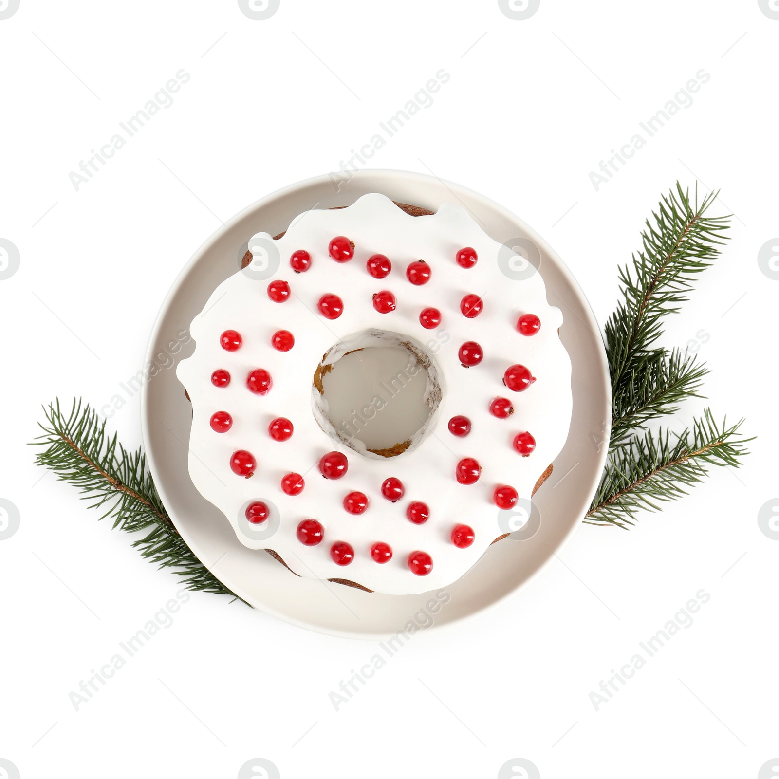 Photo of Tasty Christmas cake with red currants and fir branches isolated on white, top view